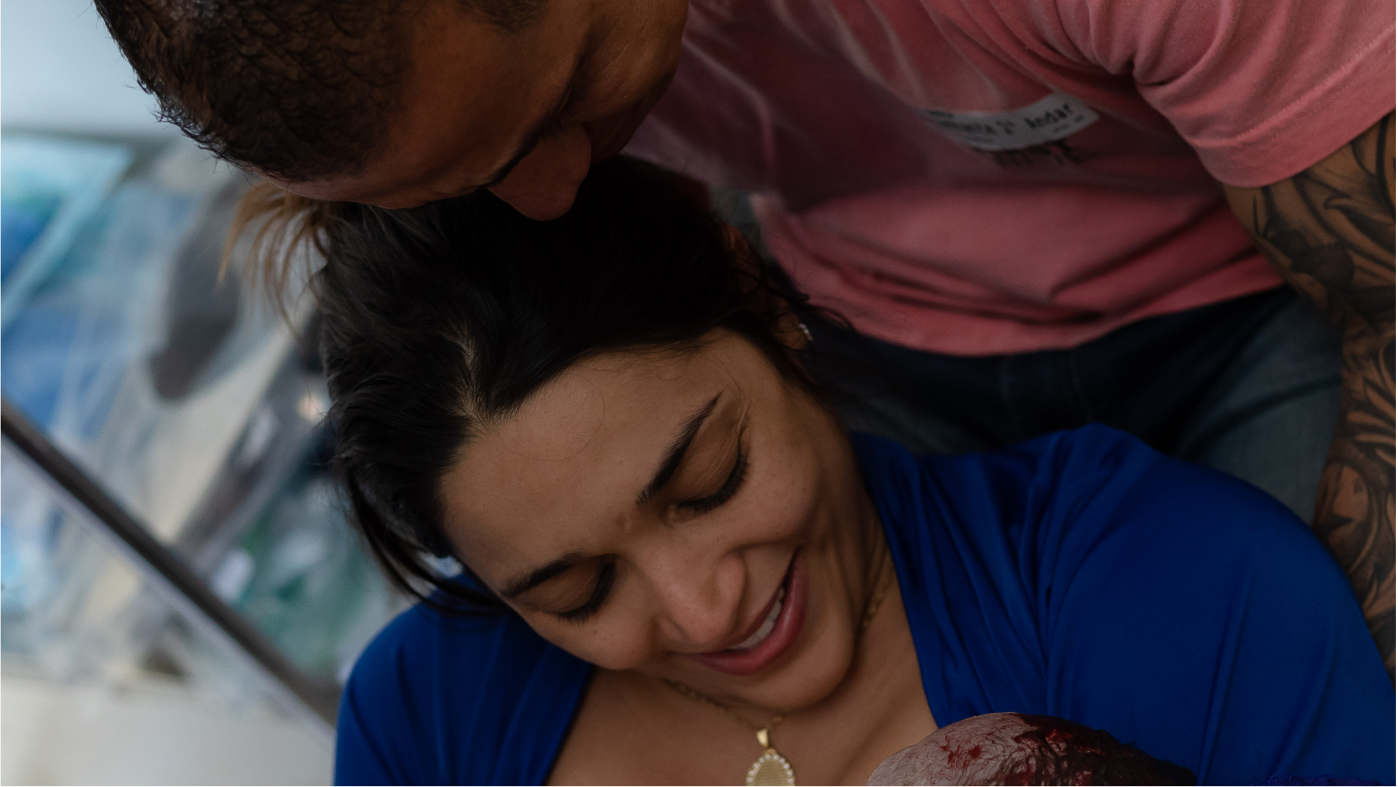 Couple in a warm moment with newborn