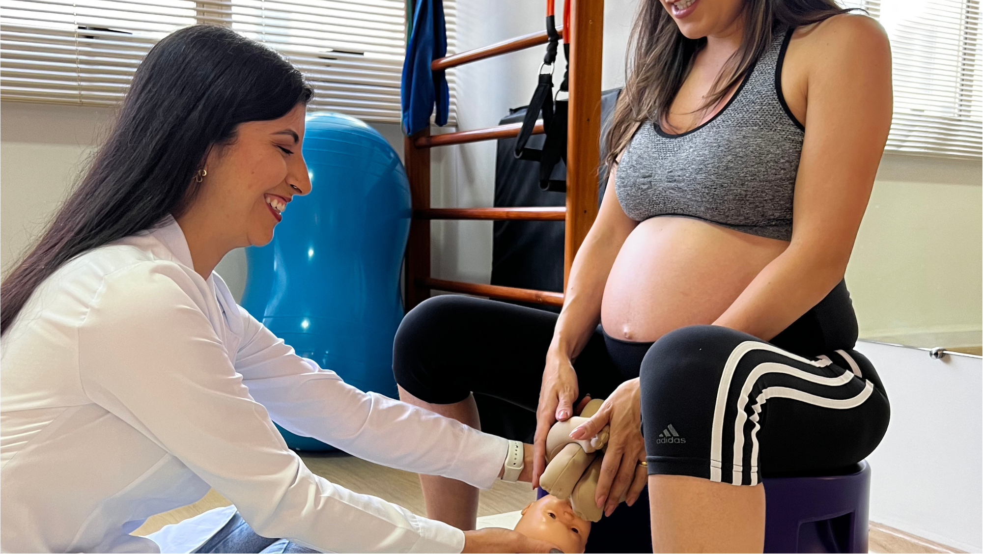 Care with pregnant patient and demonstration doll